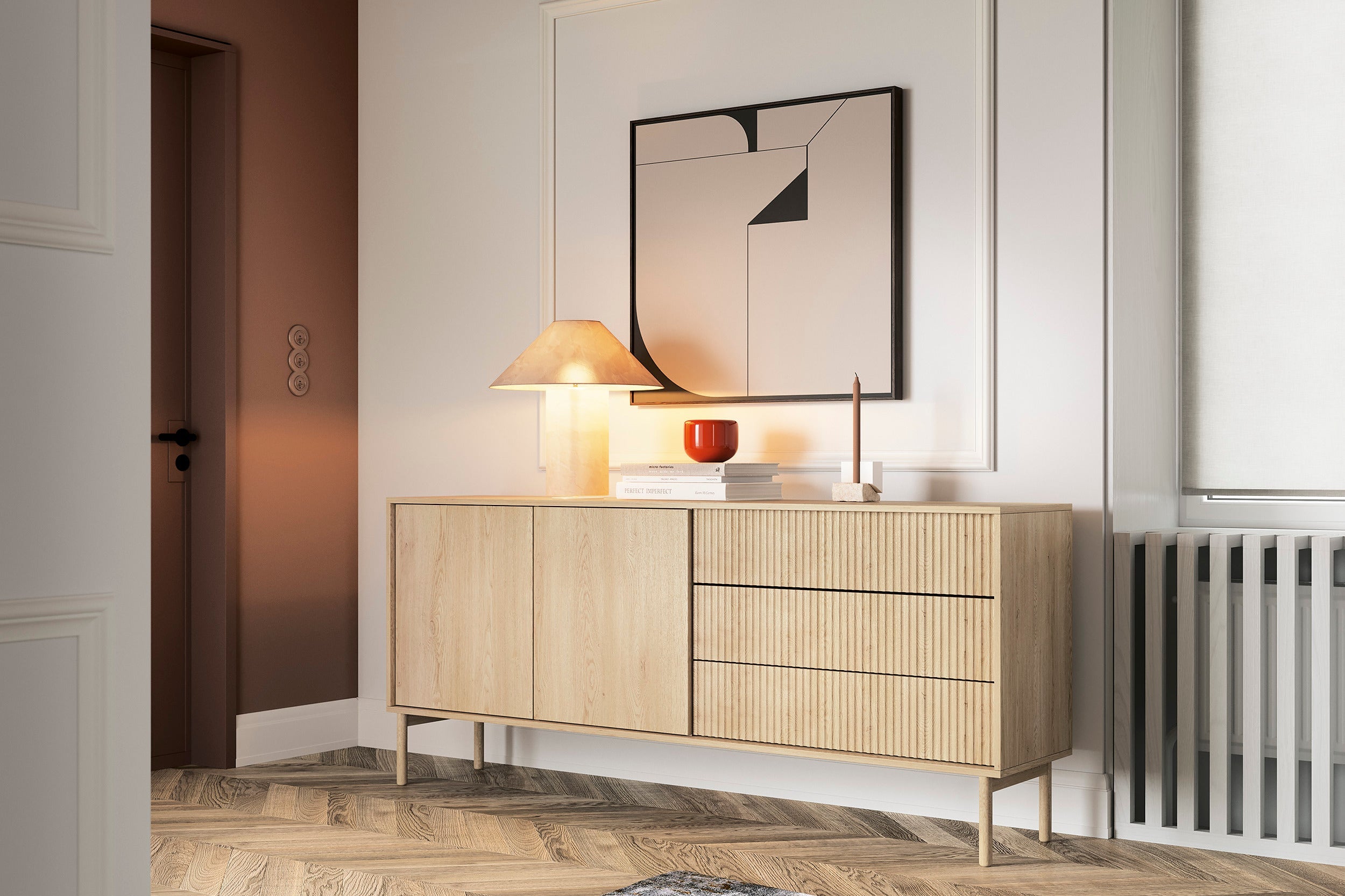 Modern light wood sideboard with fluted drawer fronts, styled with a minimalist lamp, decorative objects, and abstract wall art in a contemporary living space.