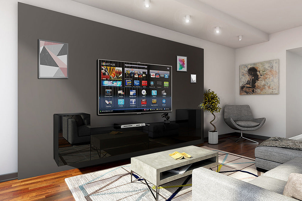 Modern floating black high-gloss TV stand with a TV mounted on a dark grey wall in a contemporary living room.