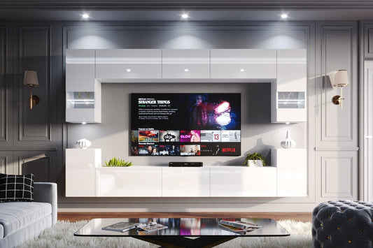 "White gloss contemporary living room furniture set featuring a sleek entertainment TV unit. Clean lines and modern design elevate the ambiance of the room."