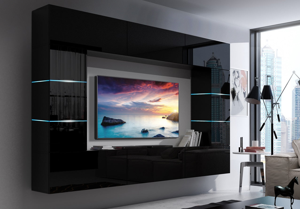 A modern and sleek black gloss TV unit set against a well-coordinated wall media background. The TV unit features clean lines, minimalist design, and integrated storage compartments. Soft LED accent lighting enhances the contemporary aesthetic, creating a stylish focal point for any living space