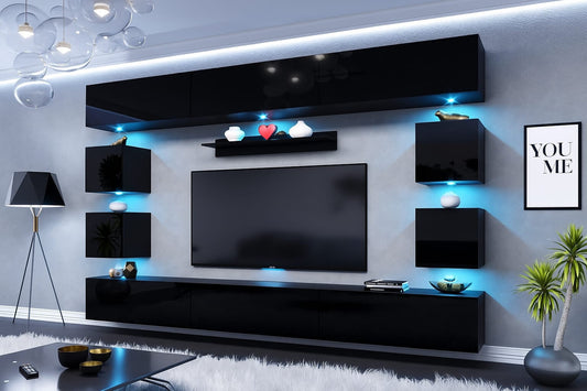 Modern living room featuring a large black high gloss wall-mounted entertainment center with integrated blue LED lights and floating storage cabinets.
